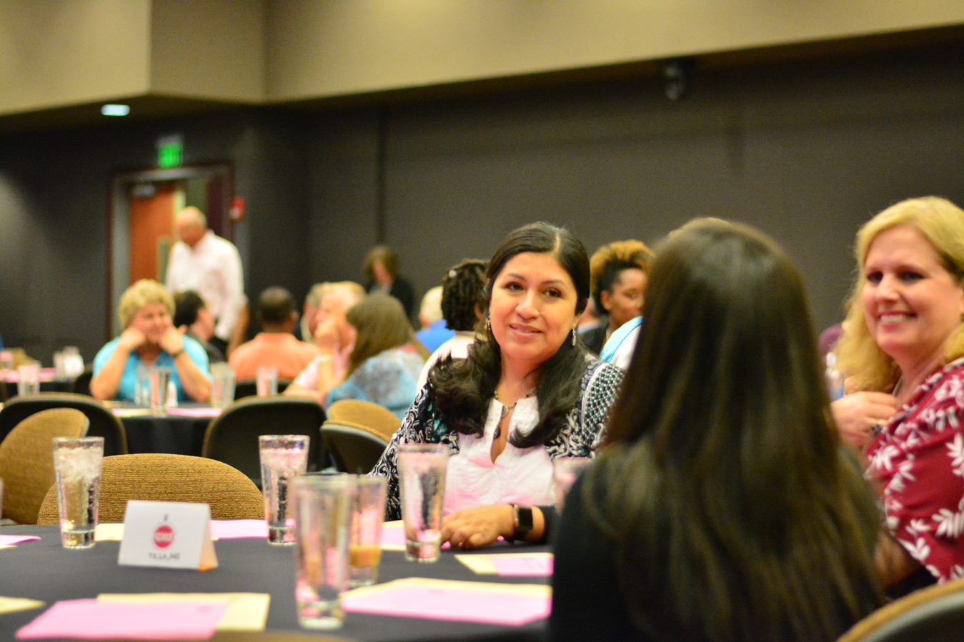 Members talking at a convening table